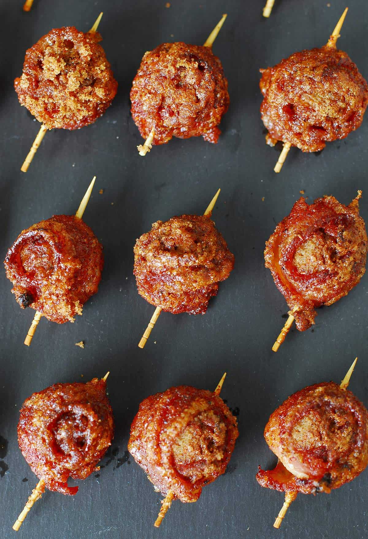 Sweet and spicy bacon wrapped meatballs.