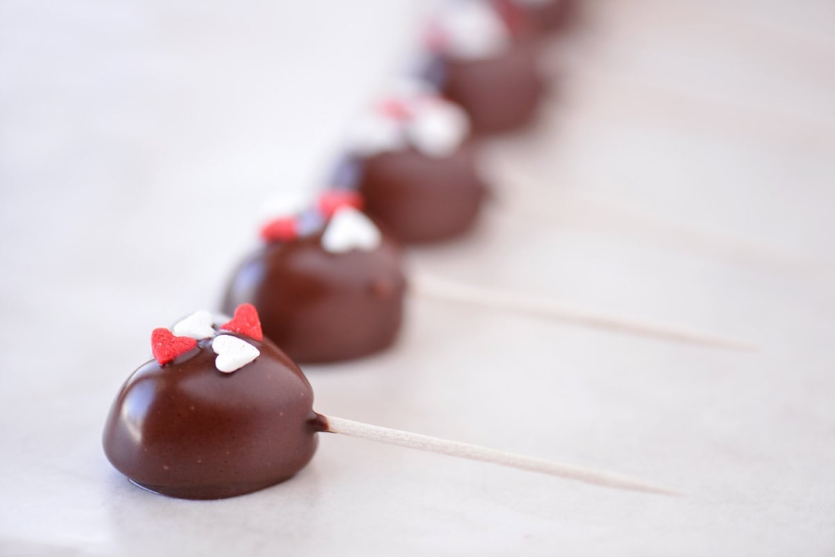 Chocolate gummy hearts with sprinkles.