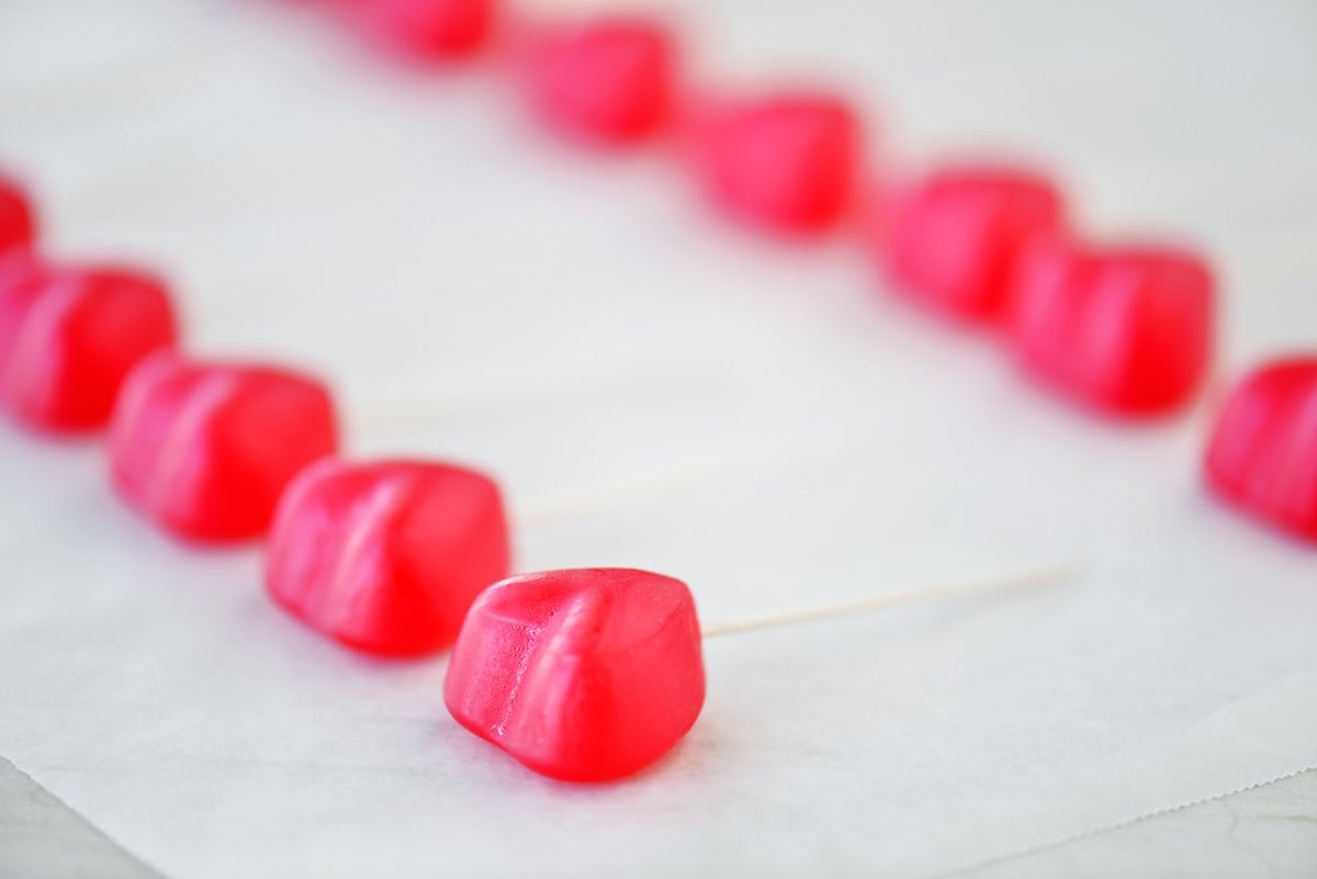 Gummy hearts with toothpicks.