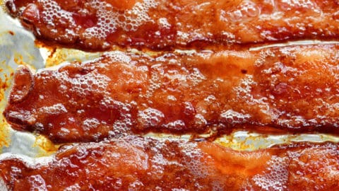 https://www.thegunnysack.com/wp-content/uploads/2019/02/Oven-Cooked-Bacon-480x270.jpg