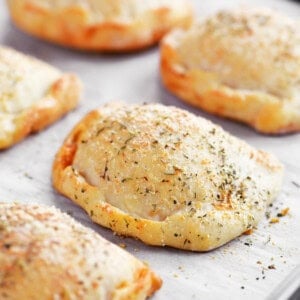 Baked calzones made with two ingredient dough.