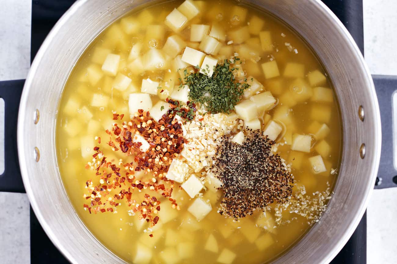 spices added to the soup in the pot