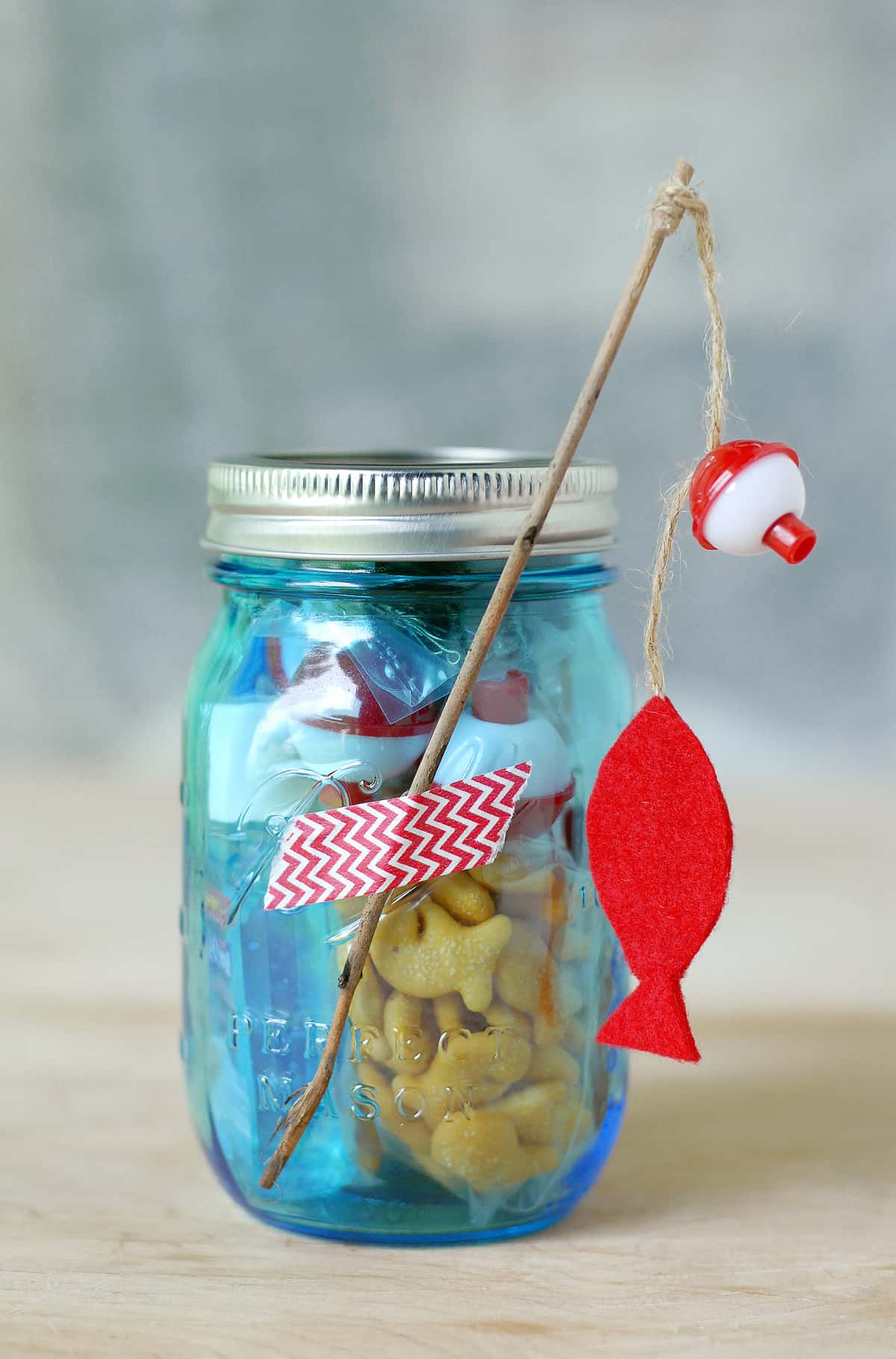 Help me build fishing themed sensory jar party favors for my son's fir
