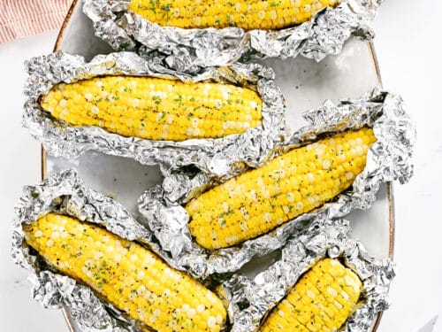 https://www.thegunnysack.com/wp-content/uploads/2023/06/Grilled-Corn-On-The-Cob-In-Foil-SQ-500x375.jpg