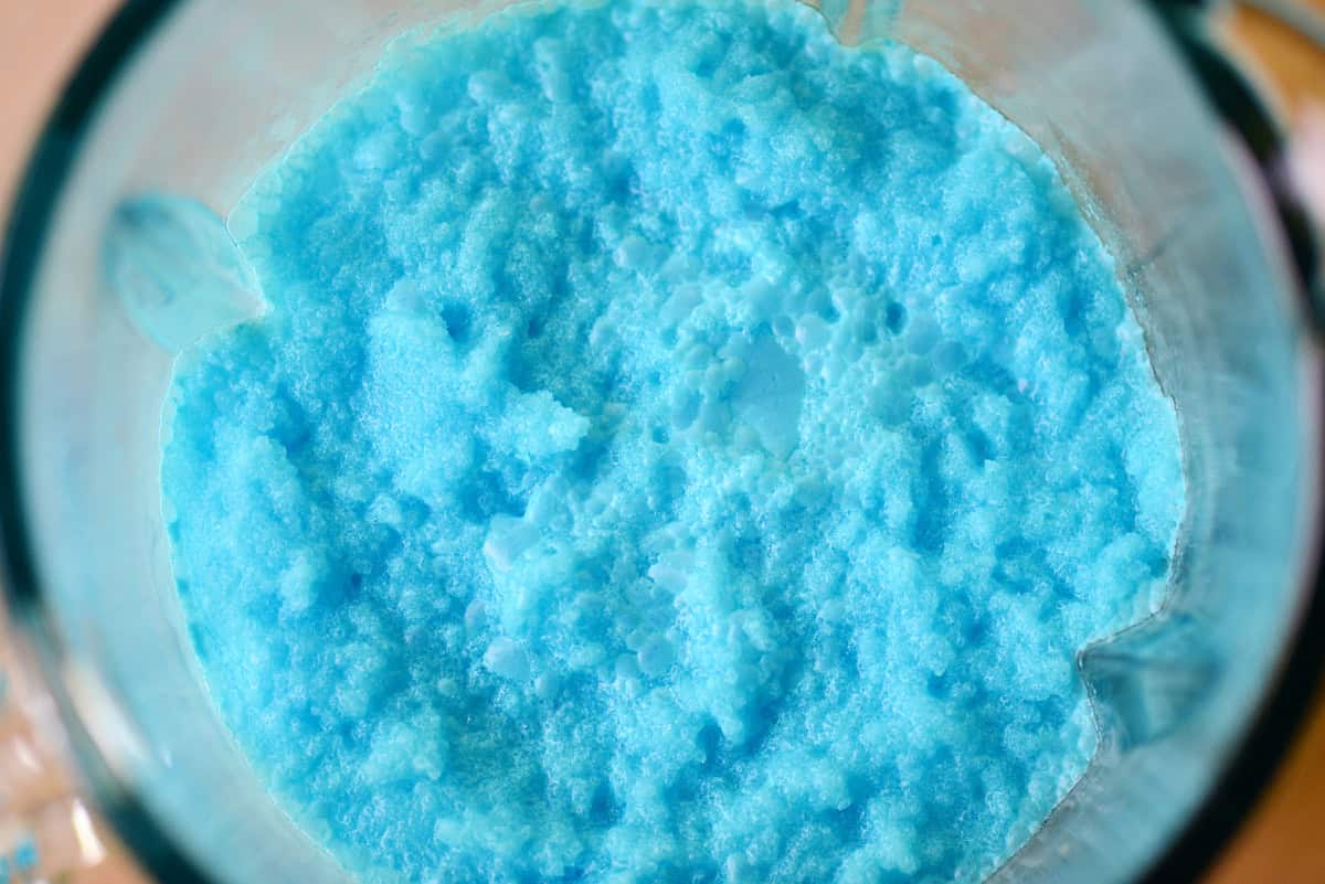 Blue slushie in a blender.
