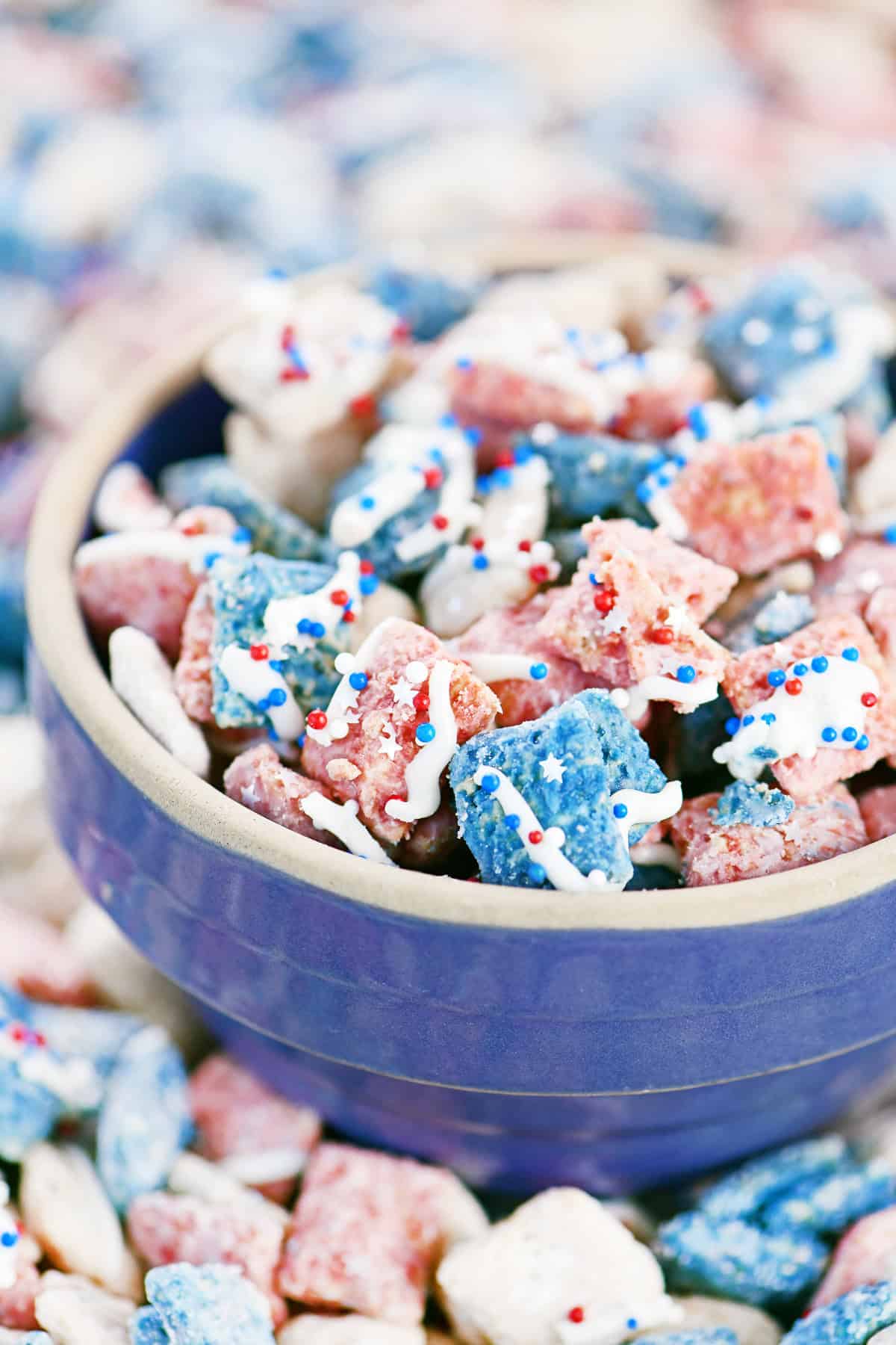 Patriotic puppy chow in a blue bowl.