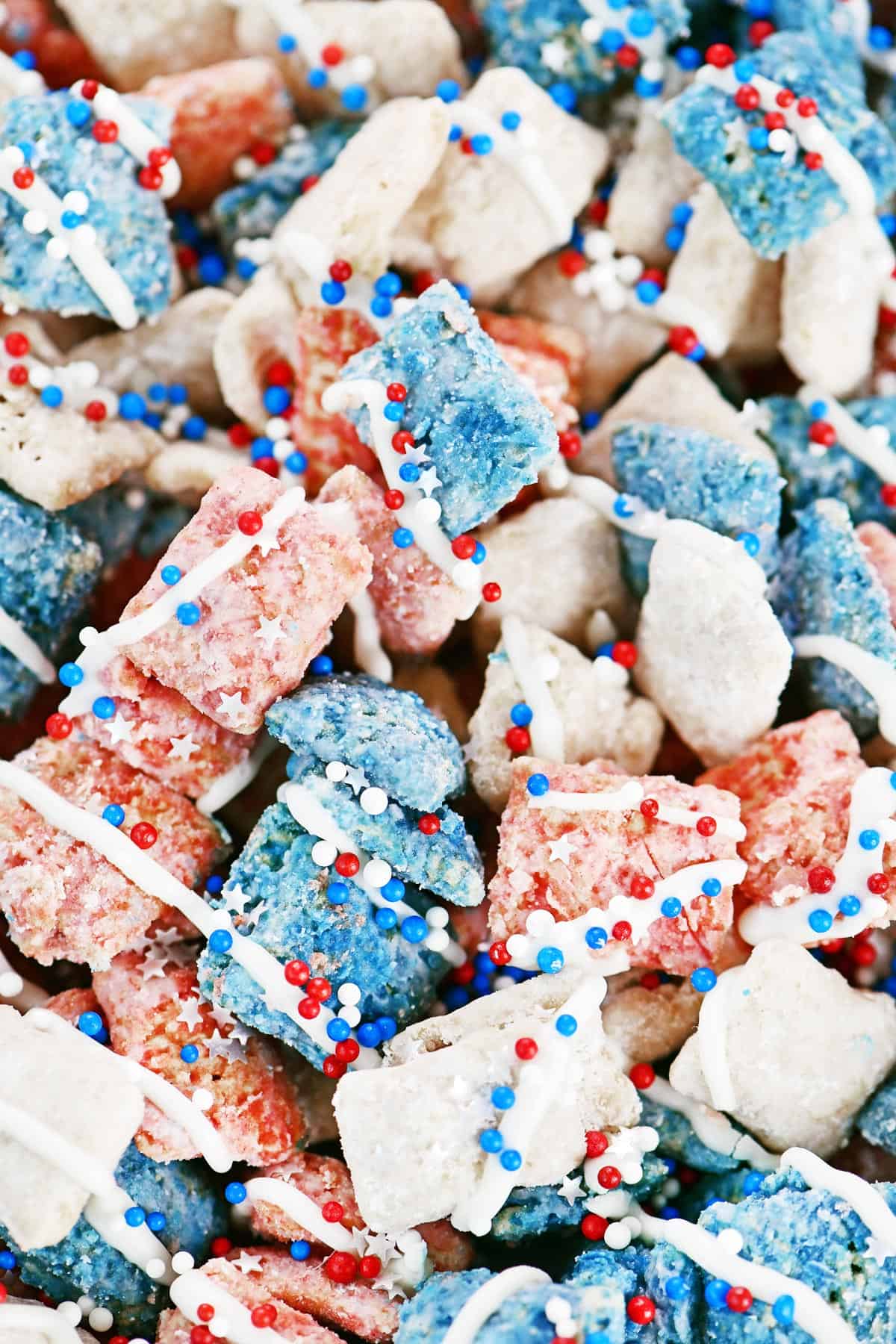Red white and blue puppy chow with sprinkles on top.