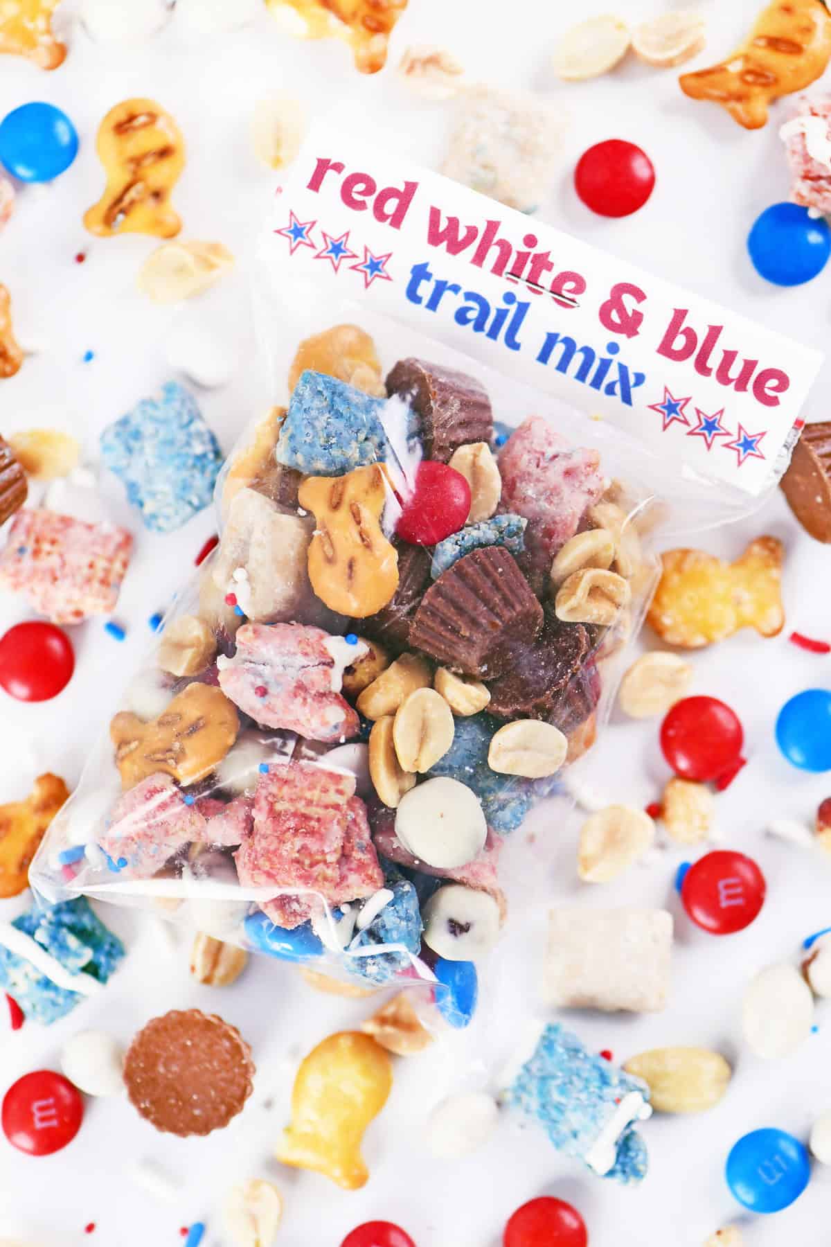 Red white and blue trail mix in a labeled bag.