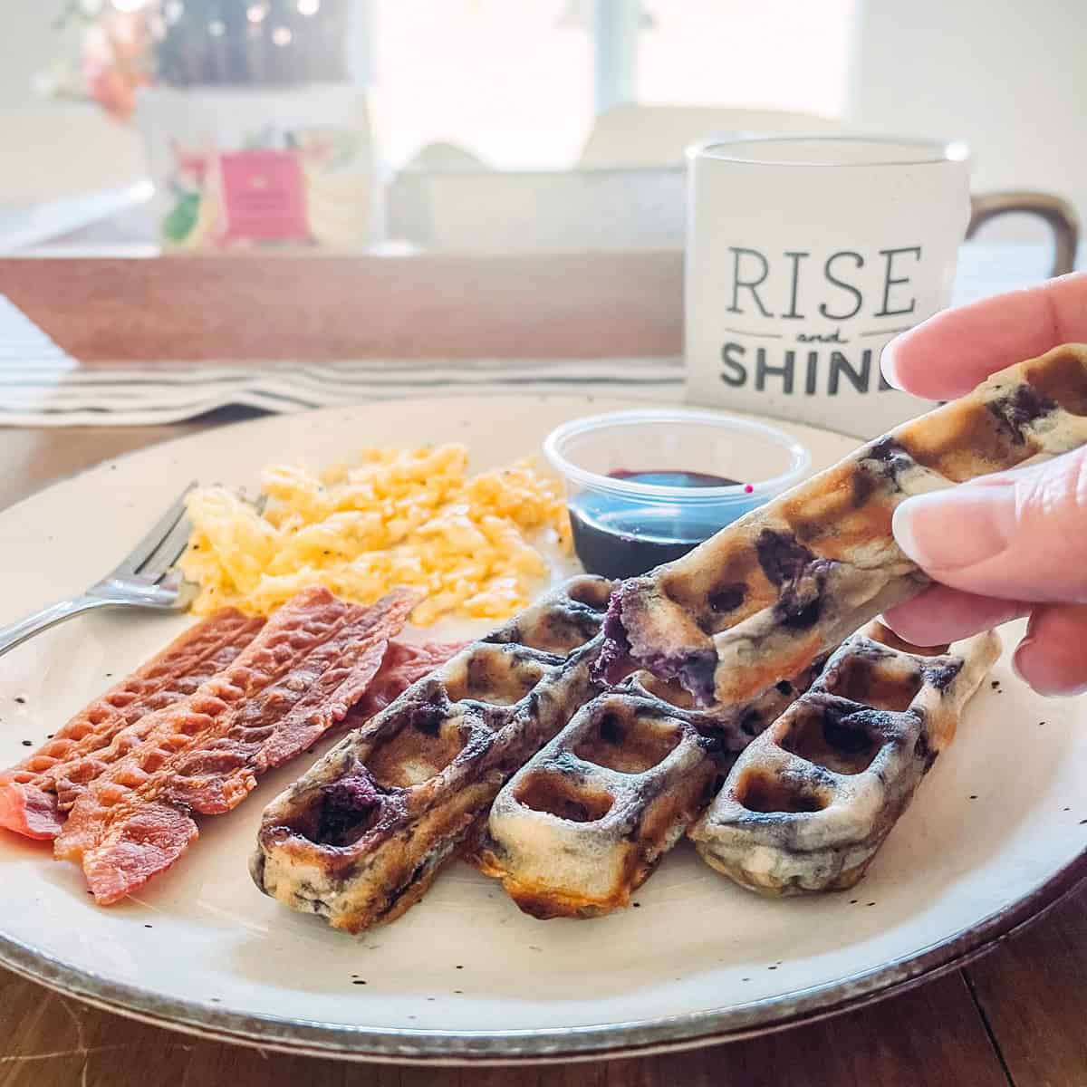 Plate of breakfast at a table.