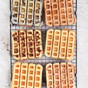 Waffles sticks cooling on a wire rack.