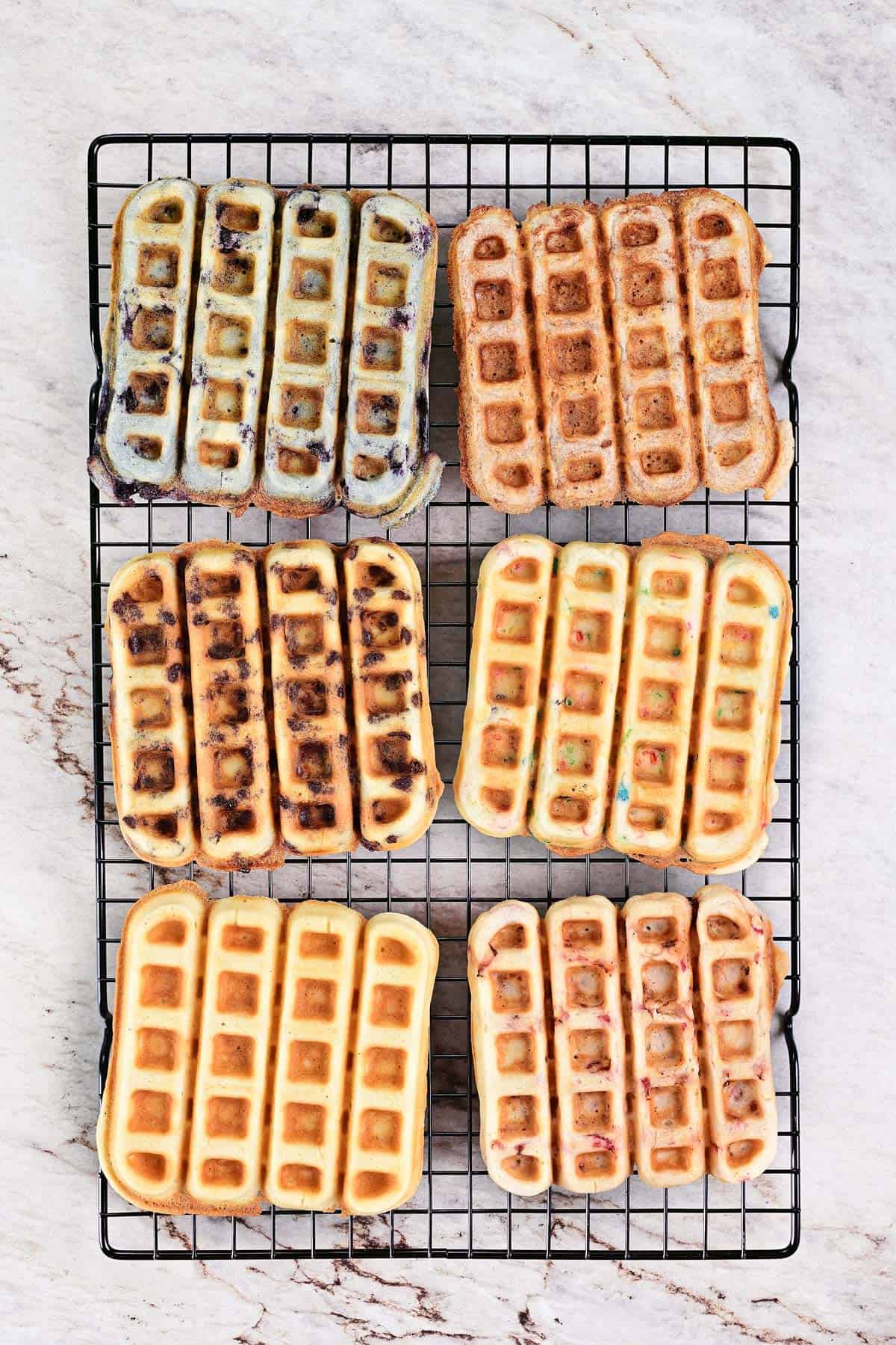 Waffles sticks cooling on a wire rack.