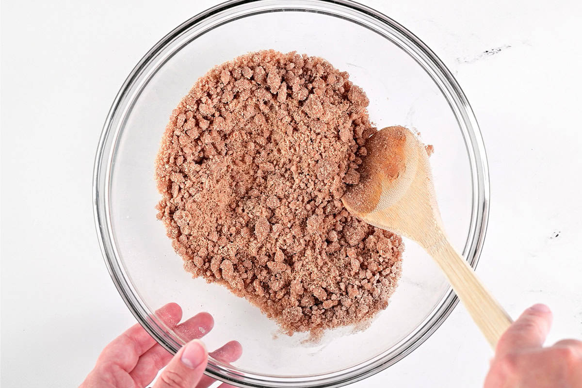 Stir butter into flour and sugar in a bowl.