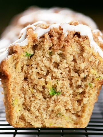 Zucchini muffins with crumble topping and glaze.