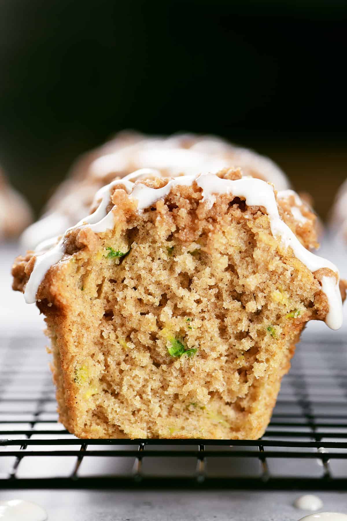 Zucchini muffins with crumble topping and glaze.