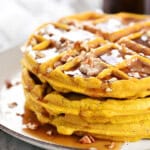 A stack of pumpkin pecan waffles.