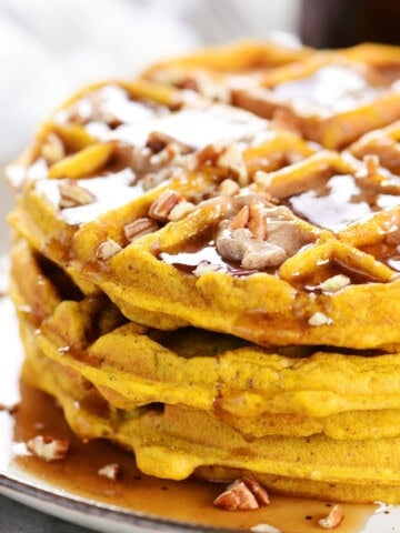 A stack of pumpkin pecan waffles.