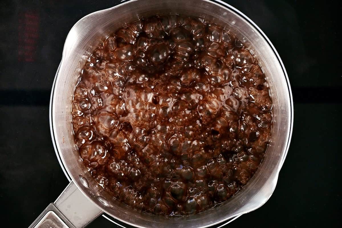 Boiling cinnamon syrup.