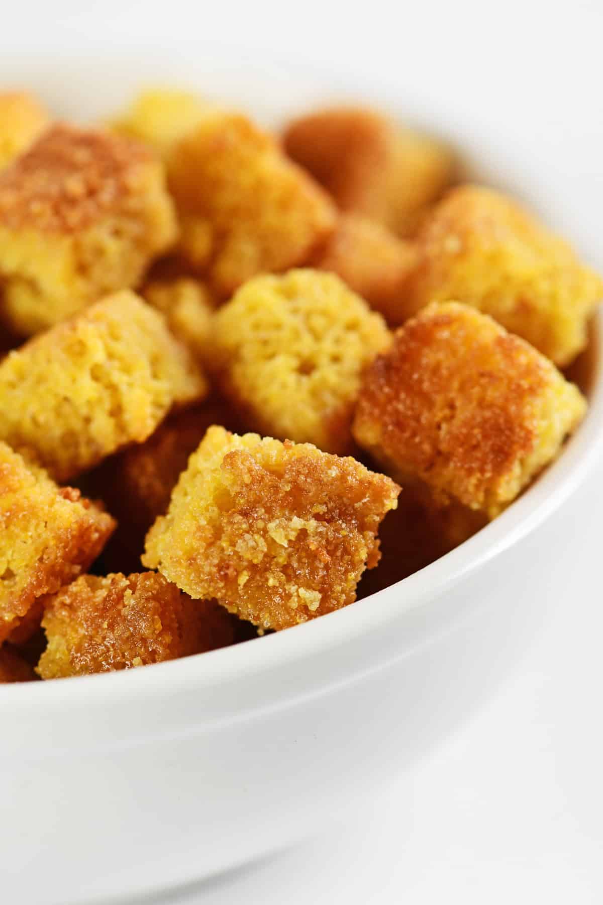 Cornbread croutons in a bowl.