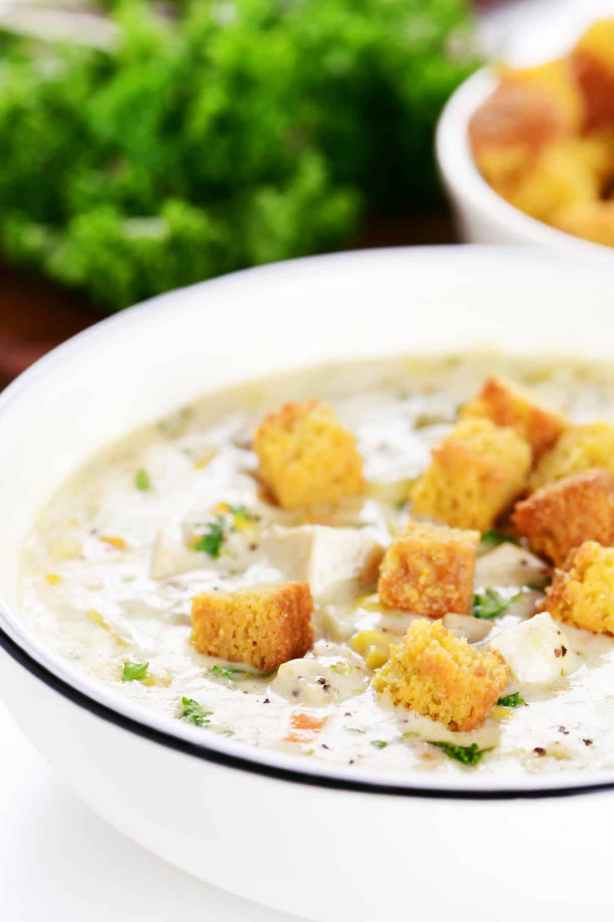 Cornbread croutons on a bowl of soup.