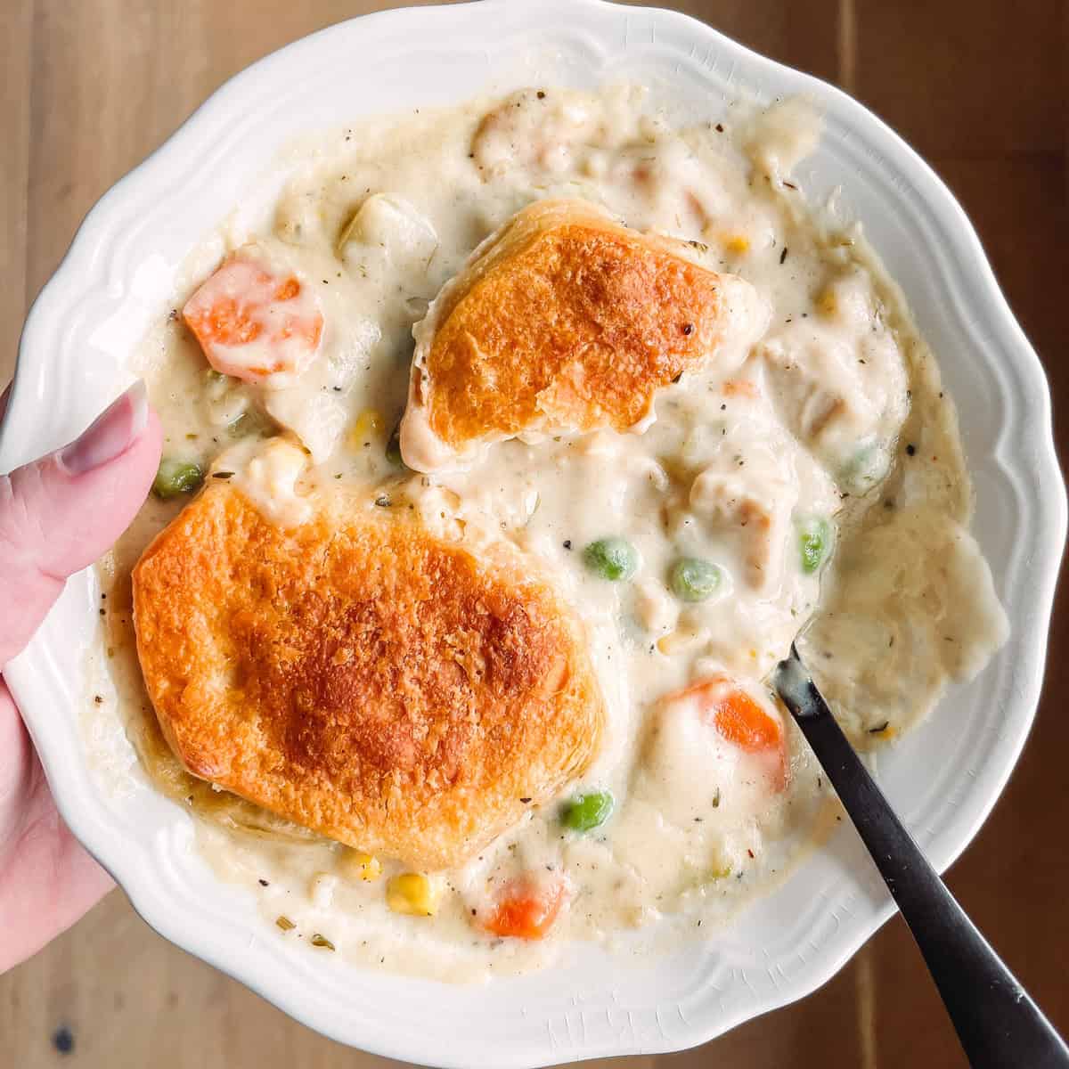 Tonia Larson holding a bowl of turkey pot pie.