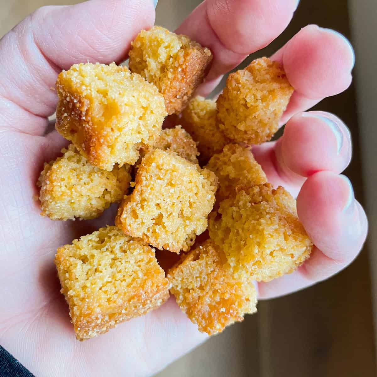 Tonia Larson holding cornbread croutons.