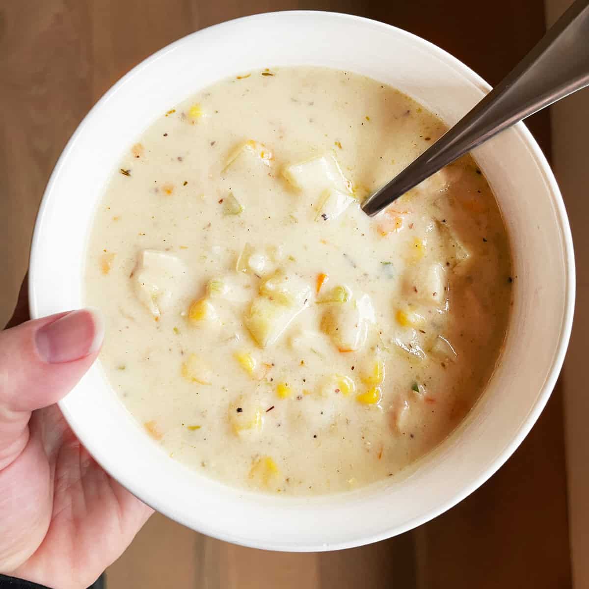 Tonia Larson holding a bowl of Thanksgiving soup.