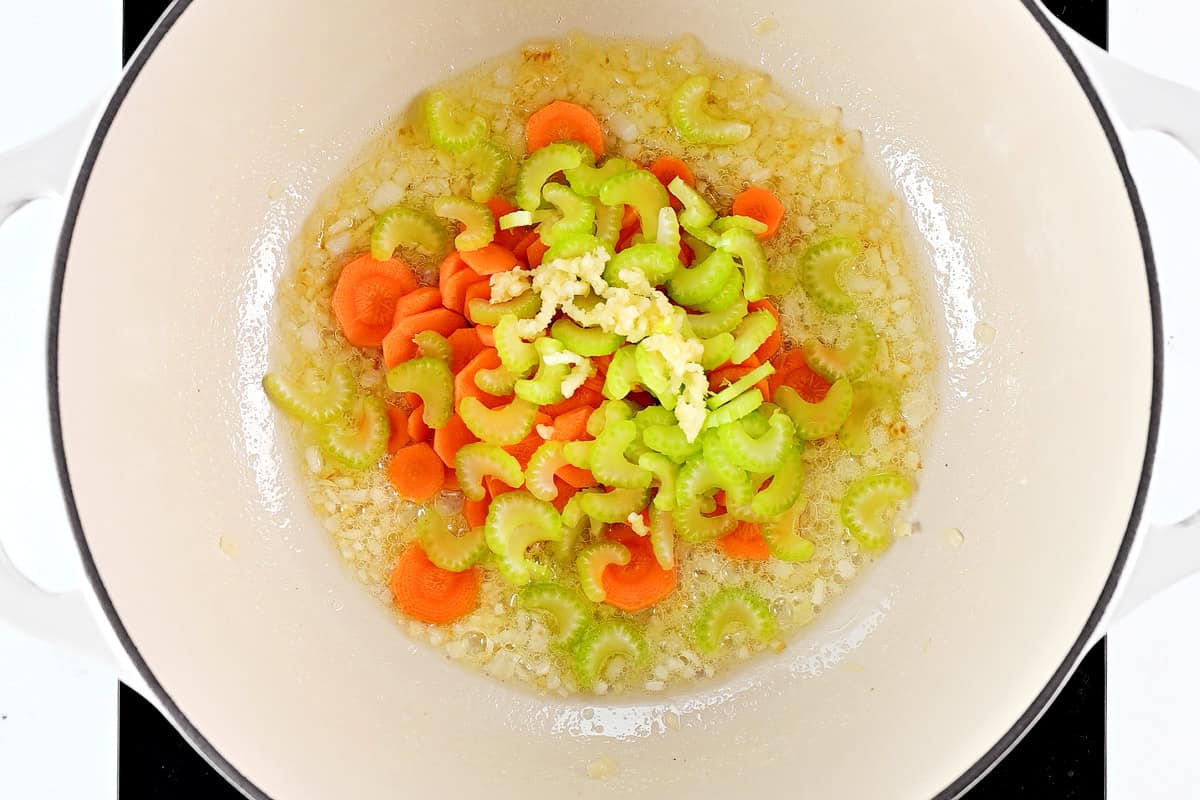 Carrots, celery, and onions in a Dutch oven.