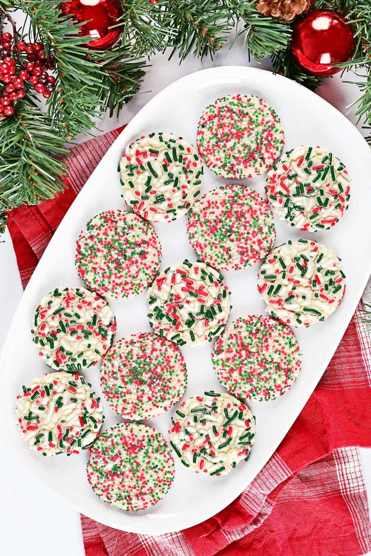 Sprinkle sugar cookies on a tray.