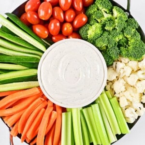 Cottage cheese ranch dip and veggies on a tray.