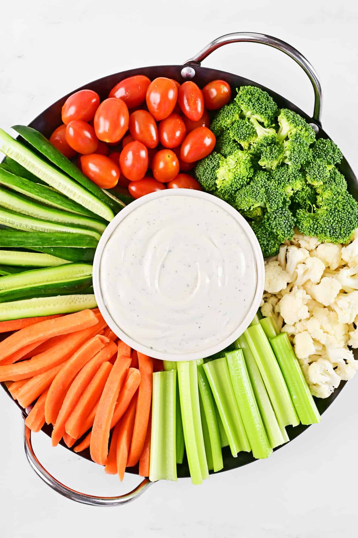 Cottage cheese ranch dip and veggies on a tray.