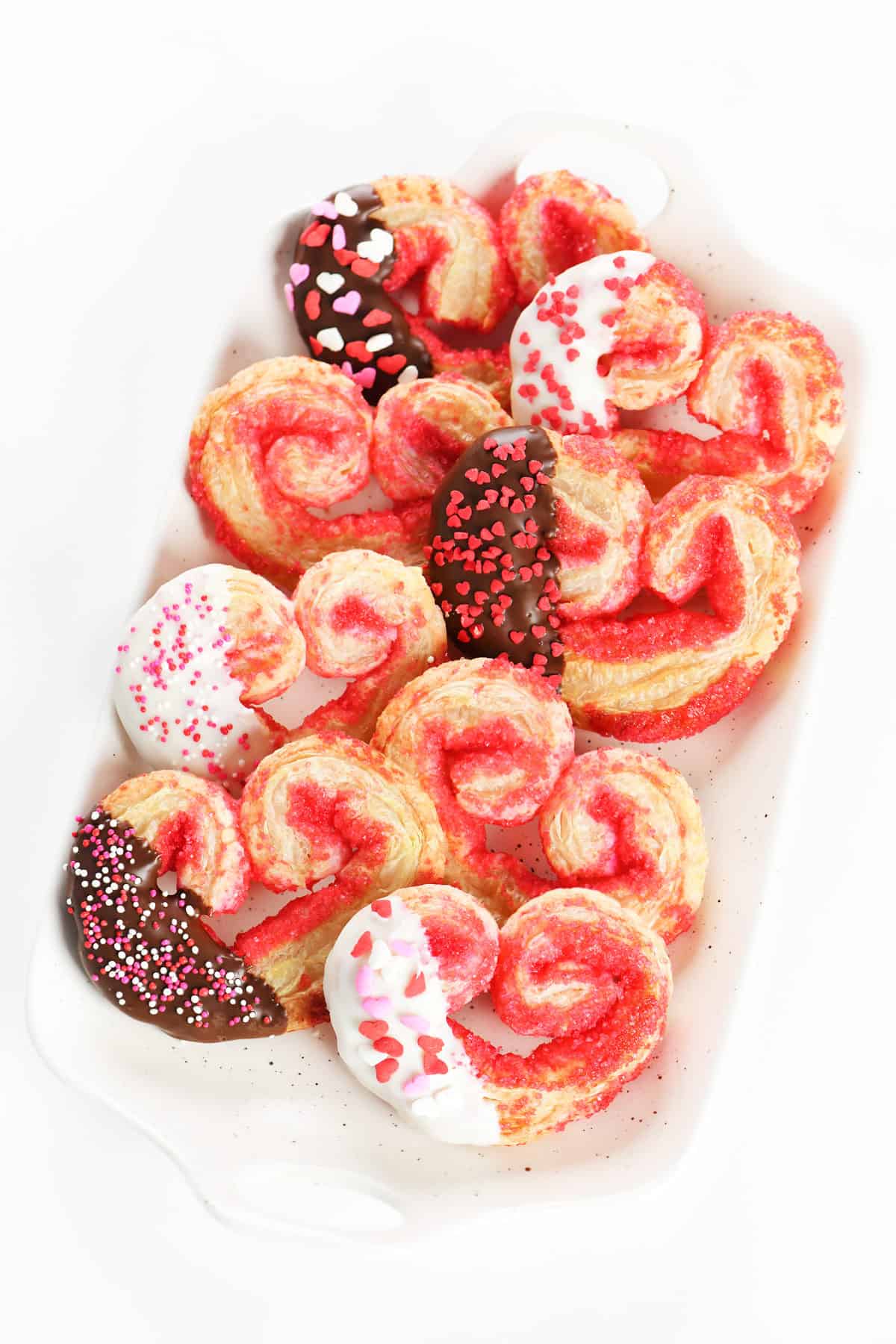 Tray of heart shaped puff pastry cookies.