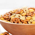 Spicy Chex mix recipe served in a wooden bowl.