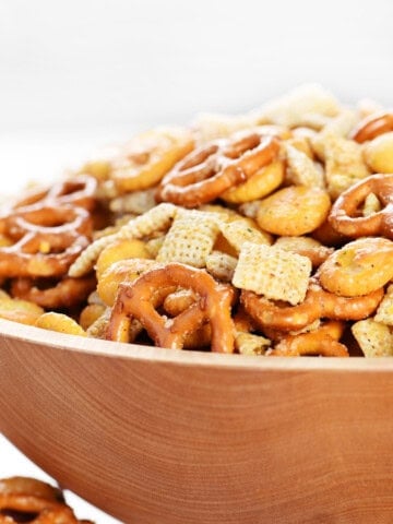 Spicy Chex mix recipe served in a wooden bowl.