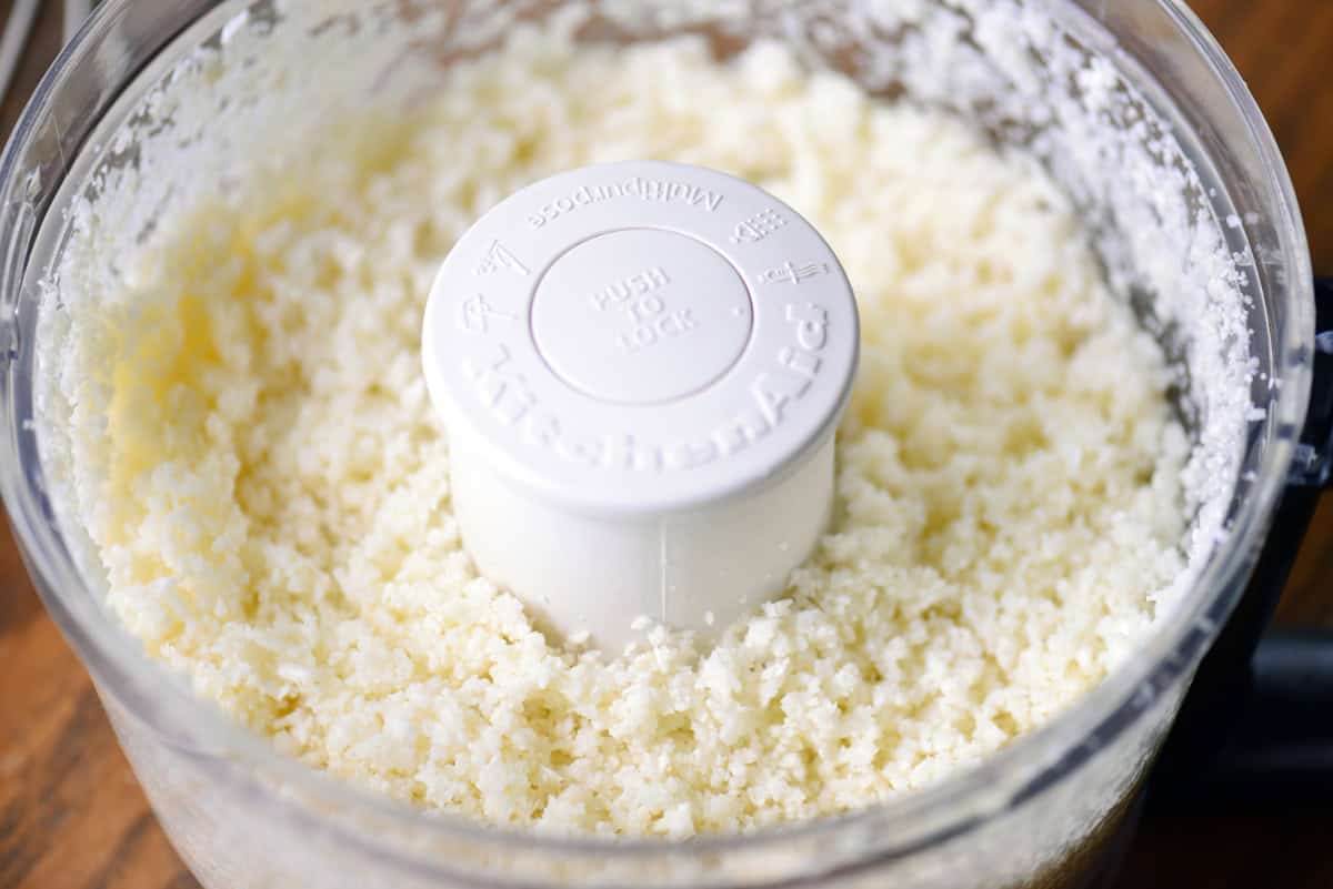 Riced cauliflower in a food processor.