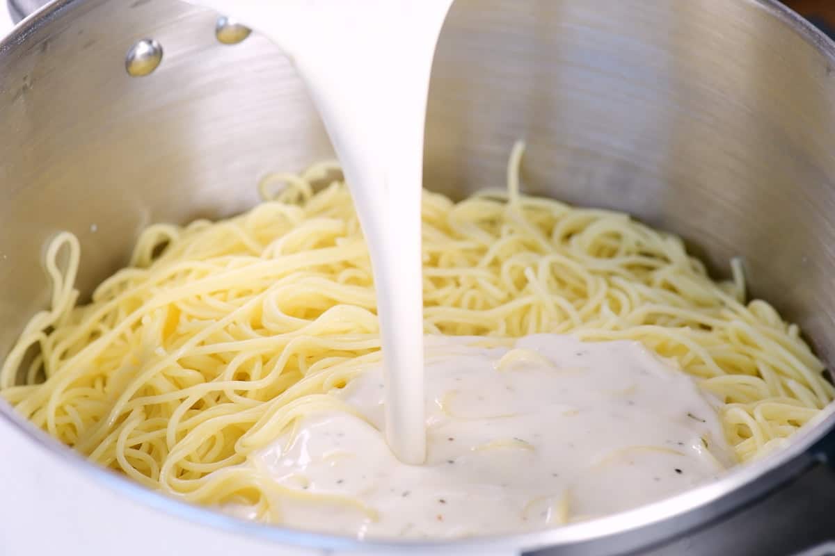 Pour the creamy sauce on the cooked angel hair pasta.